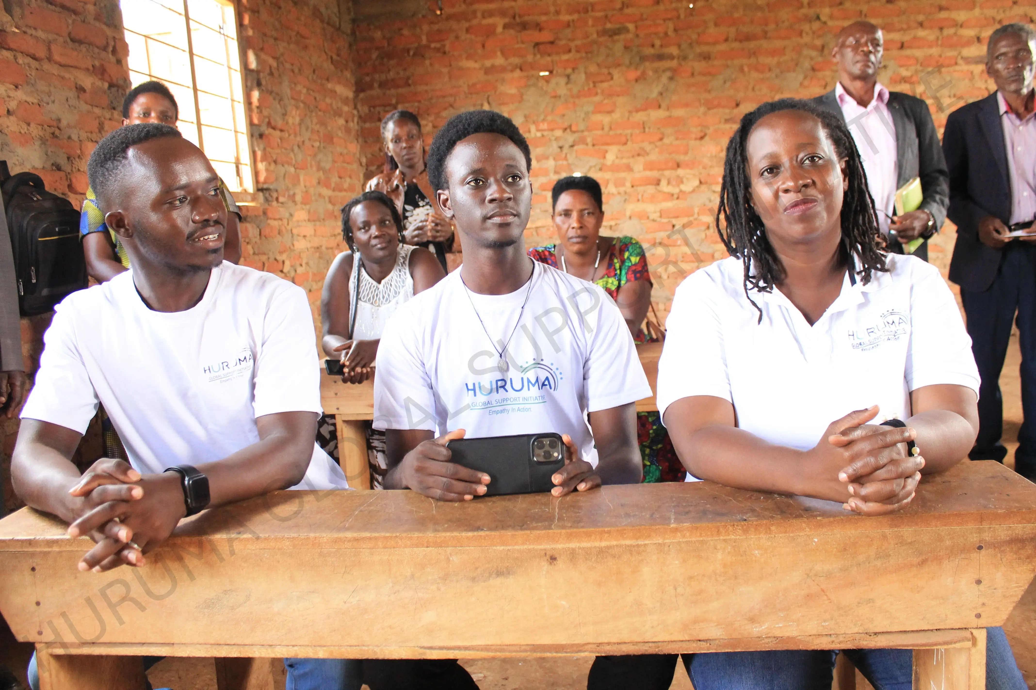 Huruma team members working together at a desk