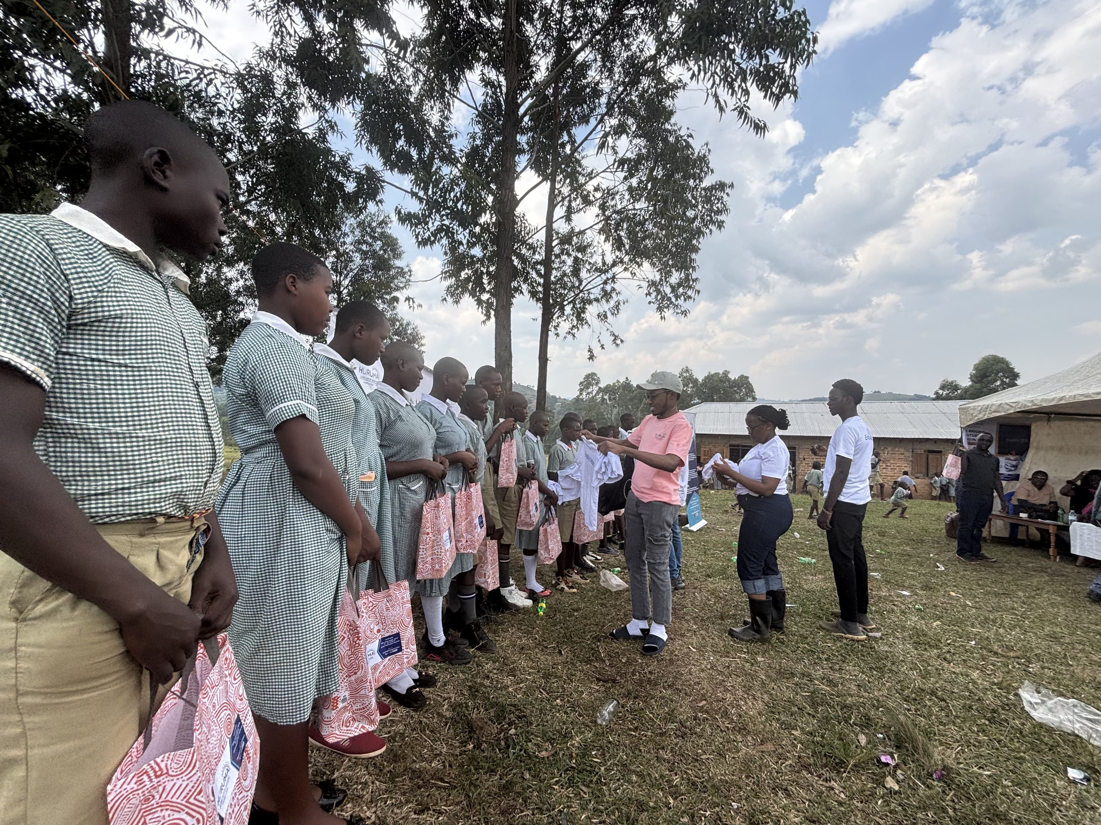 Primary Seven pupils lined up to receive learning materials