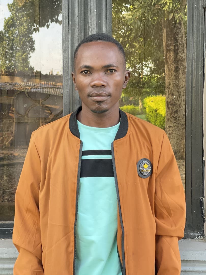 Portrait of Ssebuguzi Alex, Programme Officer for Sustainable Livelihoods
